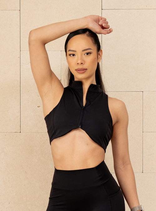 Sculpt Zip Crop in Carbon, a black sleeveless zip crop top, front view on a model