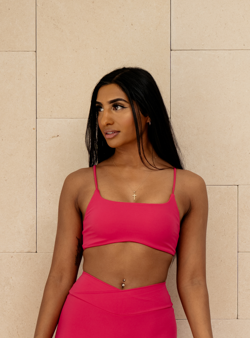 Sculpt Bralette in Plastic Pink, a pink bralette with thin straps, front view on a model